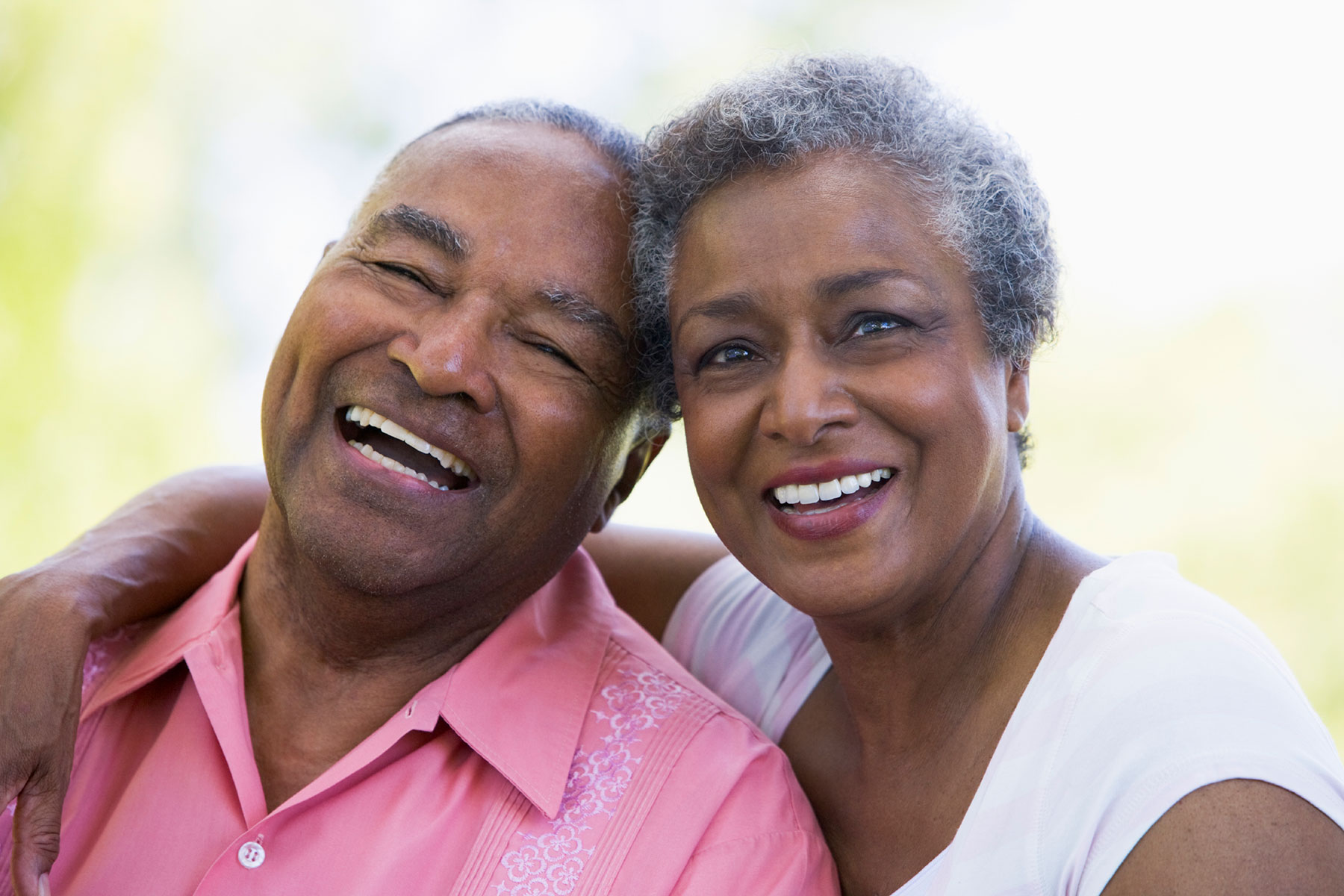 senior African American couple smiling | Is a reverse mortgage right for you