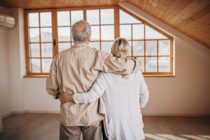 senior couple looking at house