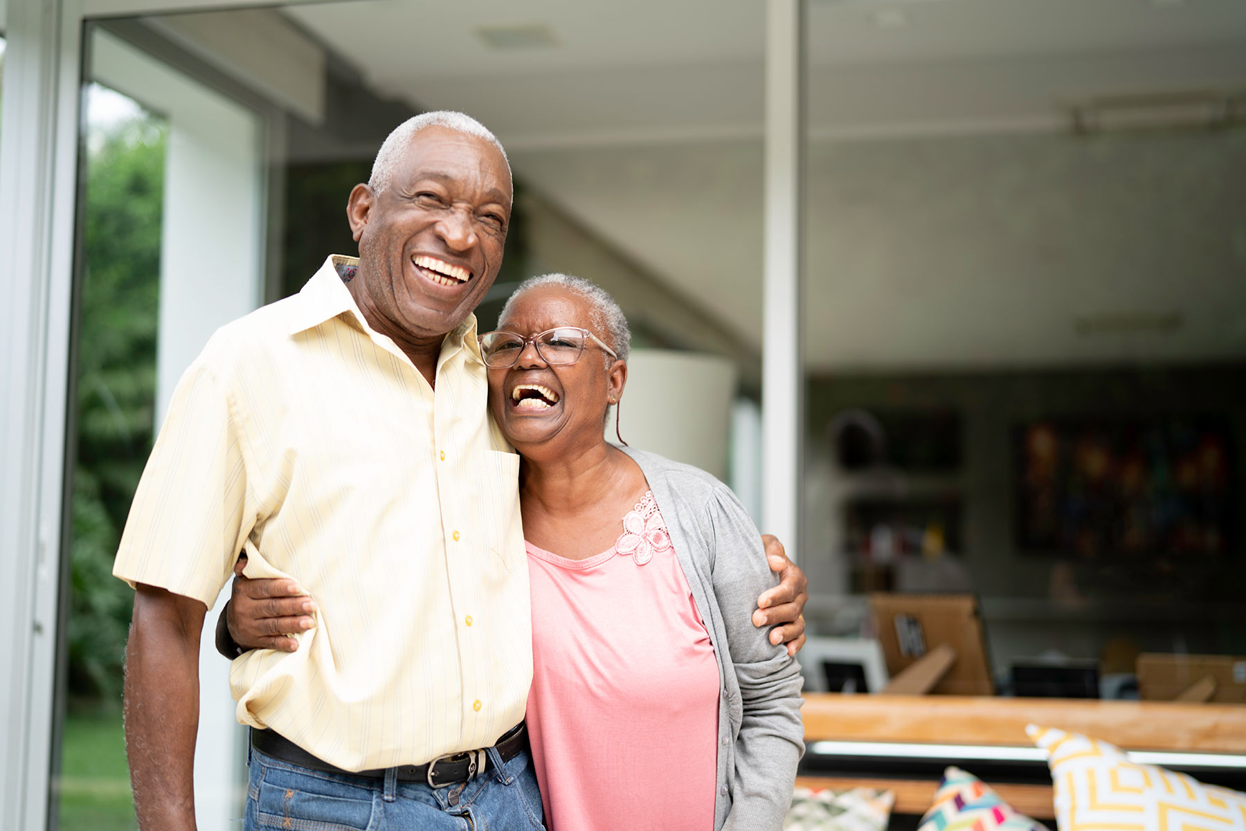 senior african american couple hugging and laughing
