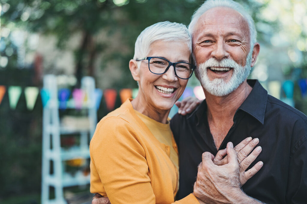 senior couple embracing and smiling