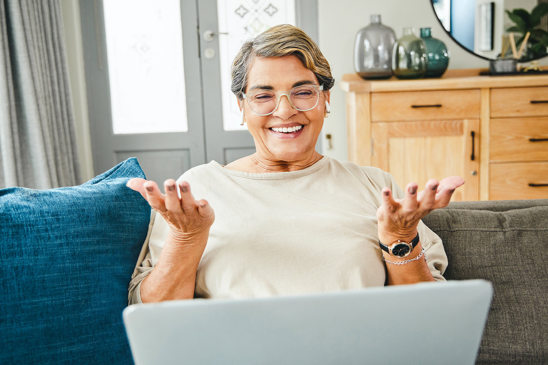 woman looking at laptop excited